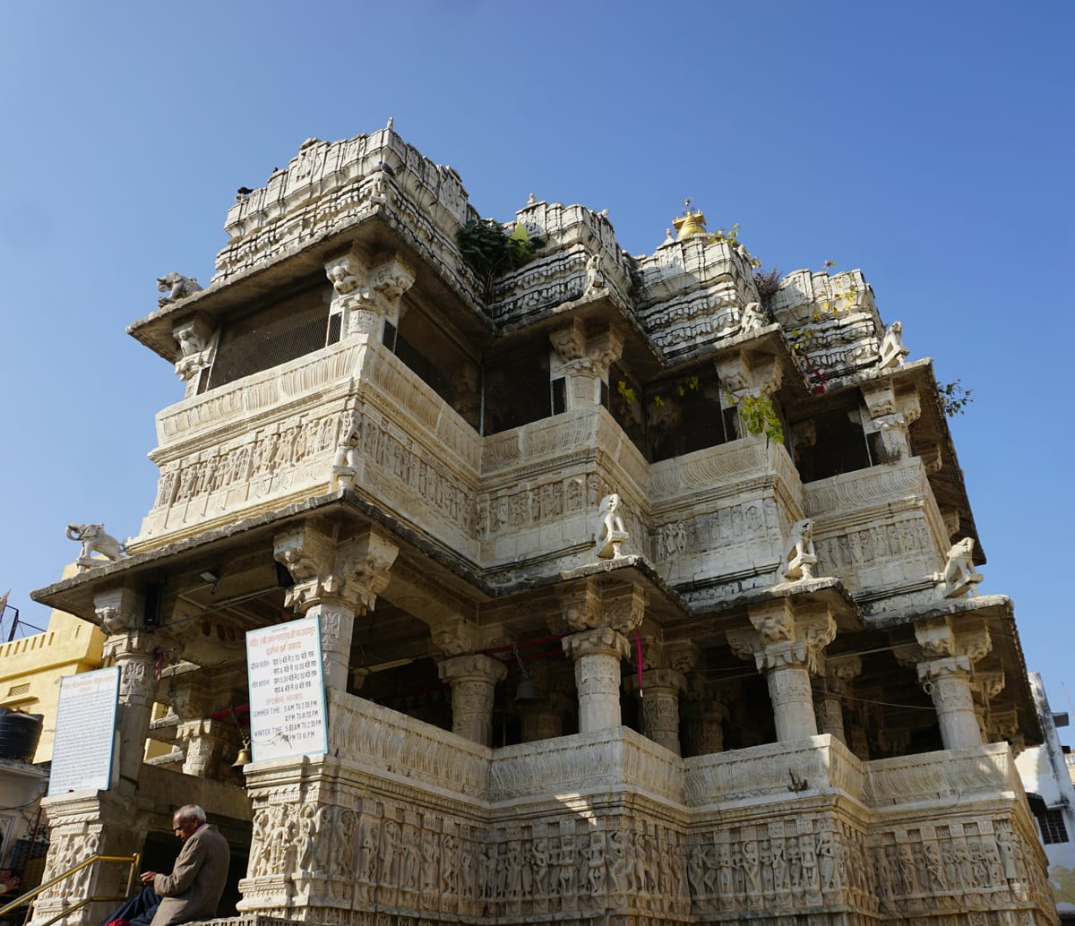 Ornately decorated temple facade in Udaipur illuminated for Janmashtami celebrations