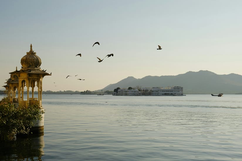 View of Lake Pichola from Gangaur Ghat with palace domes reflected on the water