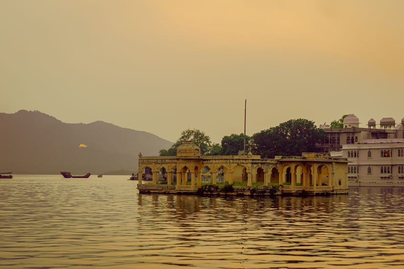 Mohan Mandir island palace on Lake Pichola surrounded by calm blue water