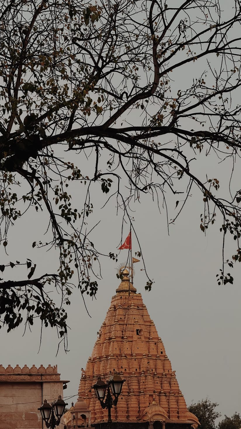Tall temple spire rising against the sky in Udaipur, traditional architecture with intricate carvings