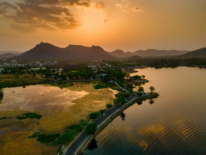 Aerial view of Udaipur's lakes and cityscape surrounded by the Aravalli Hills