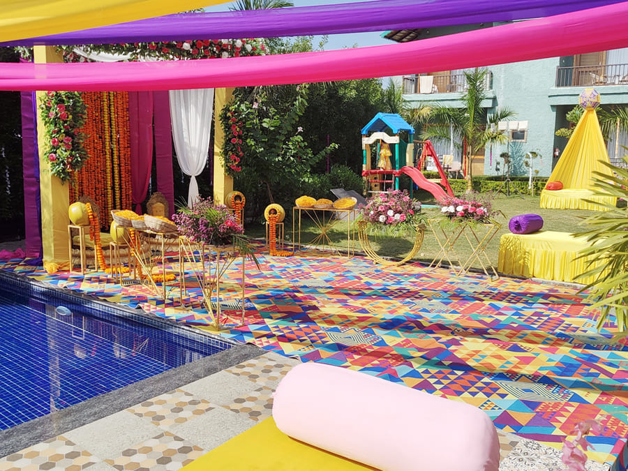 Decorated poolside event area at Corbett Nirvana Resort