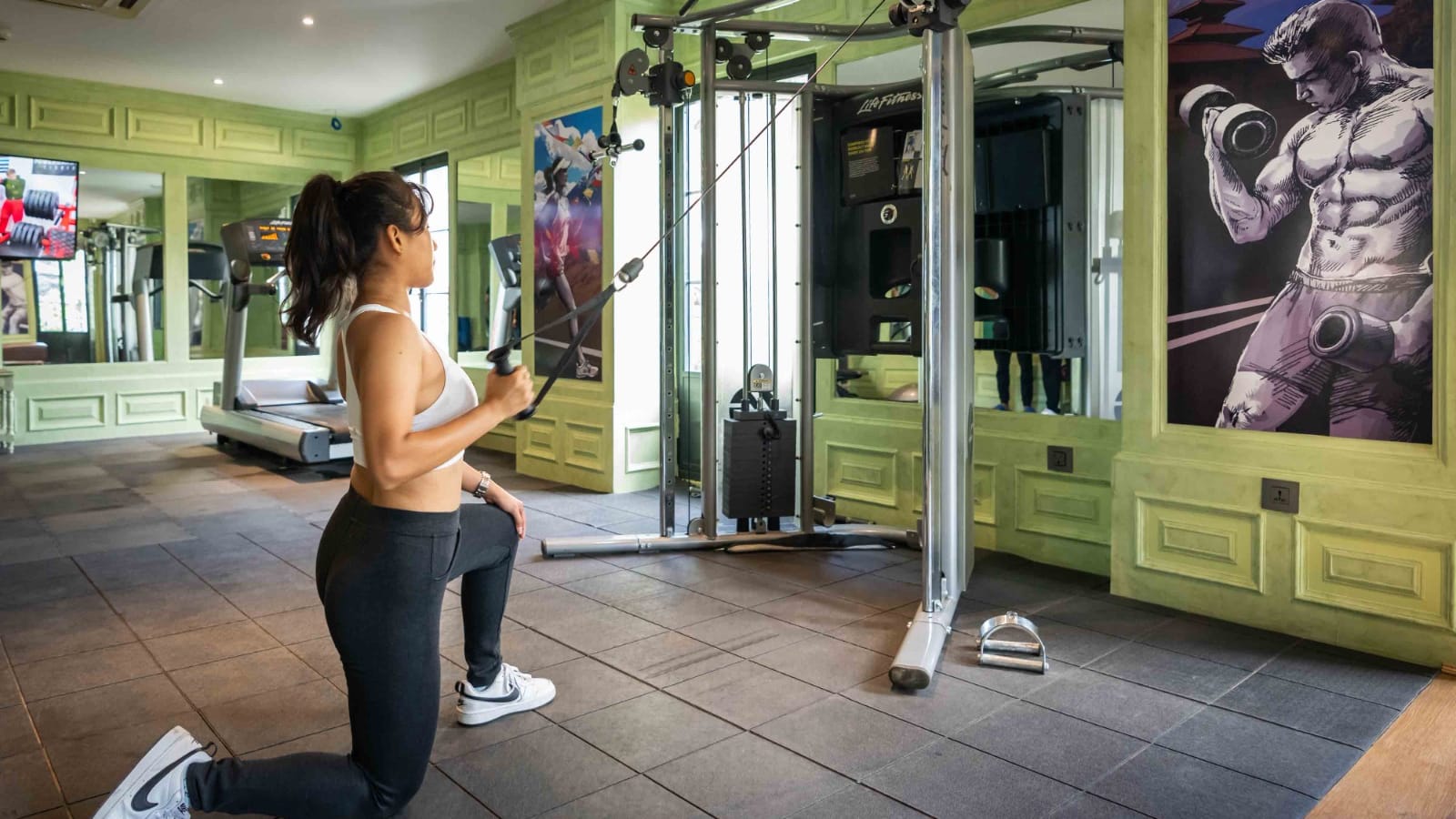 A guest training on the cable machine at the Vyayam Fitness Centre, the gym at Nepali Ghar Hotel in Thamel, Kathmandu, open daily for guest strength workouts.