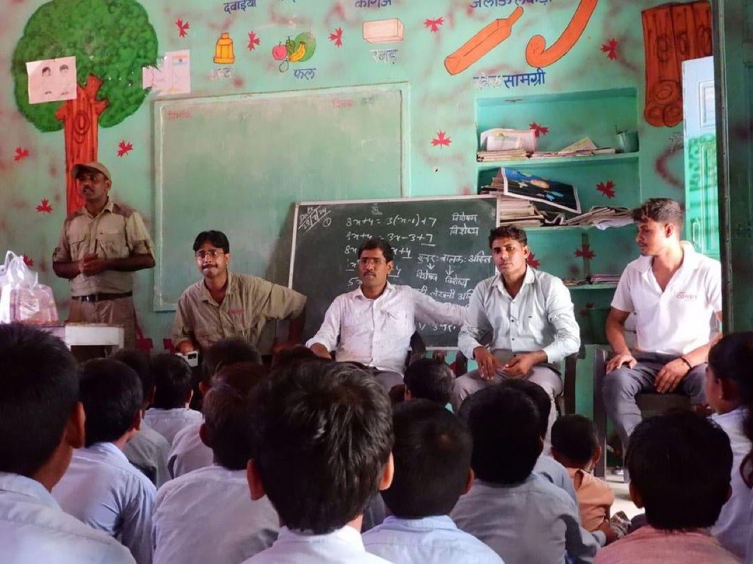 A community awareness session in the village school