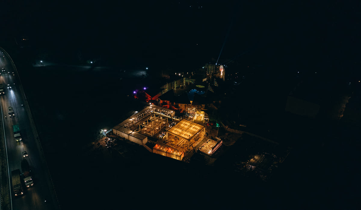 The Qualia Resort Club and Brewery lit up at night, Udaipur
