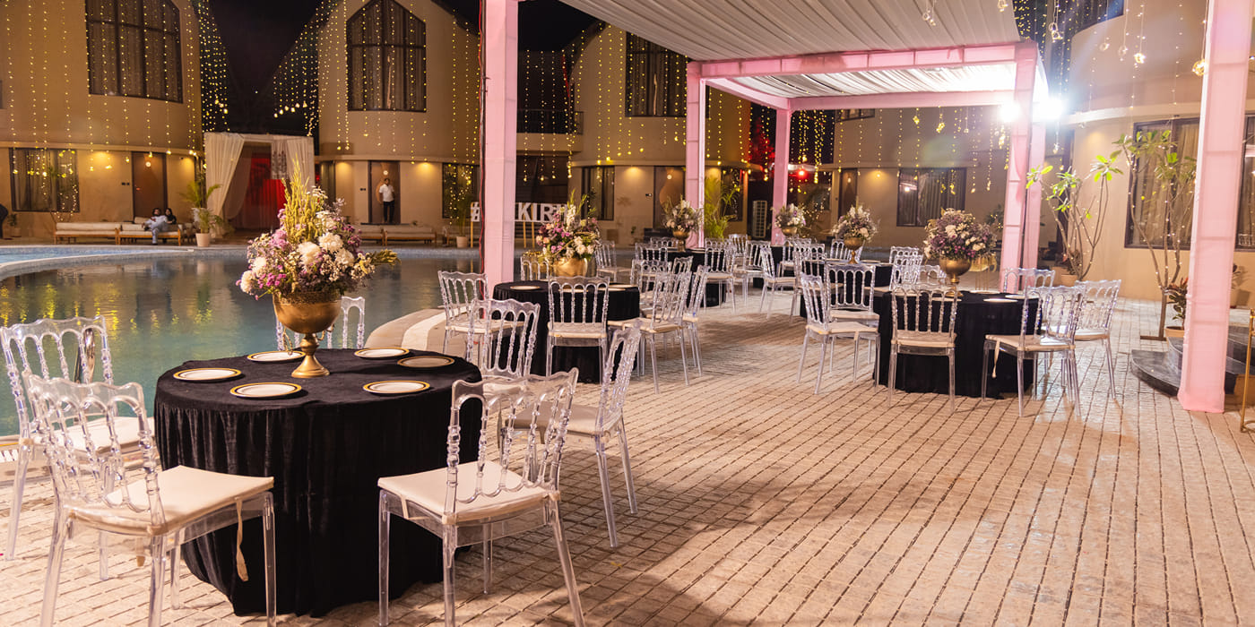 Poolside wedding reception at The Qualia Resort Club and Brewery, Udaipur