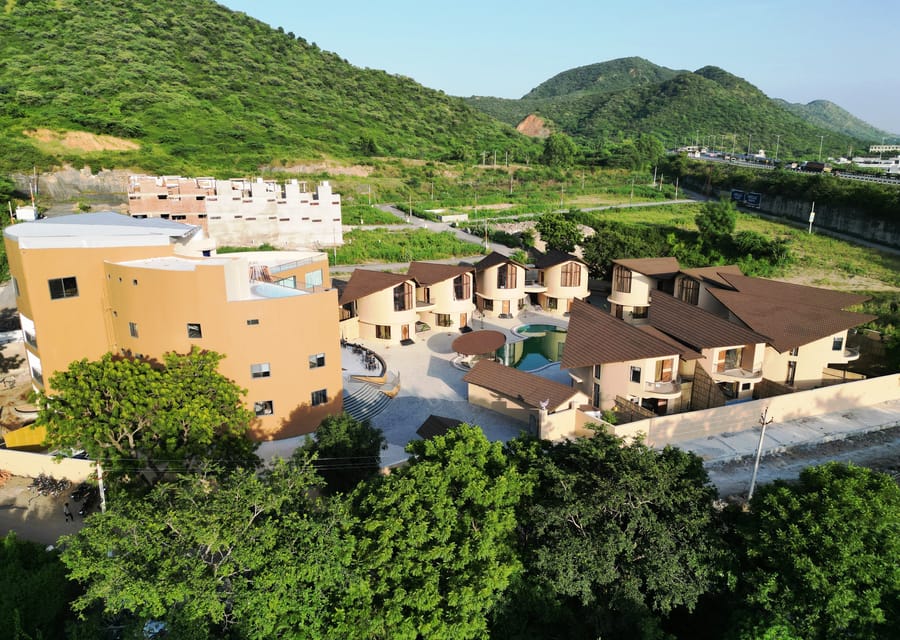 The Qualia Resort Club & Brewery facade against the Aravalli hills, Udaipur