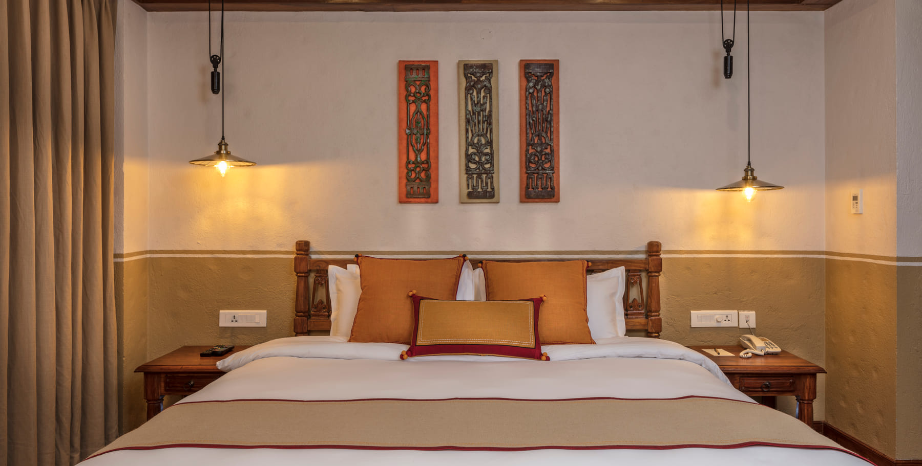 Hand-carved bed detail in the Heritage Deluxe Room
