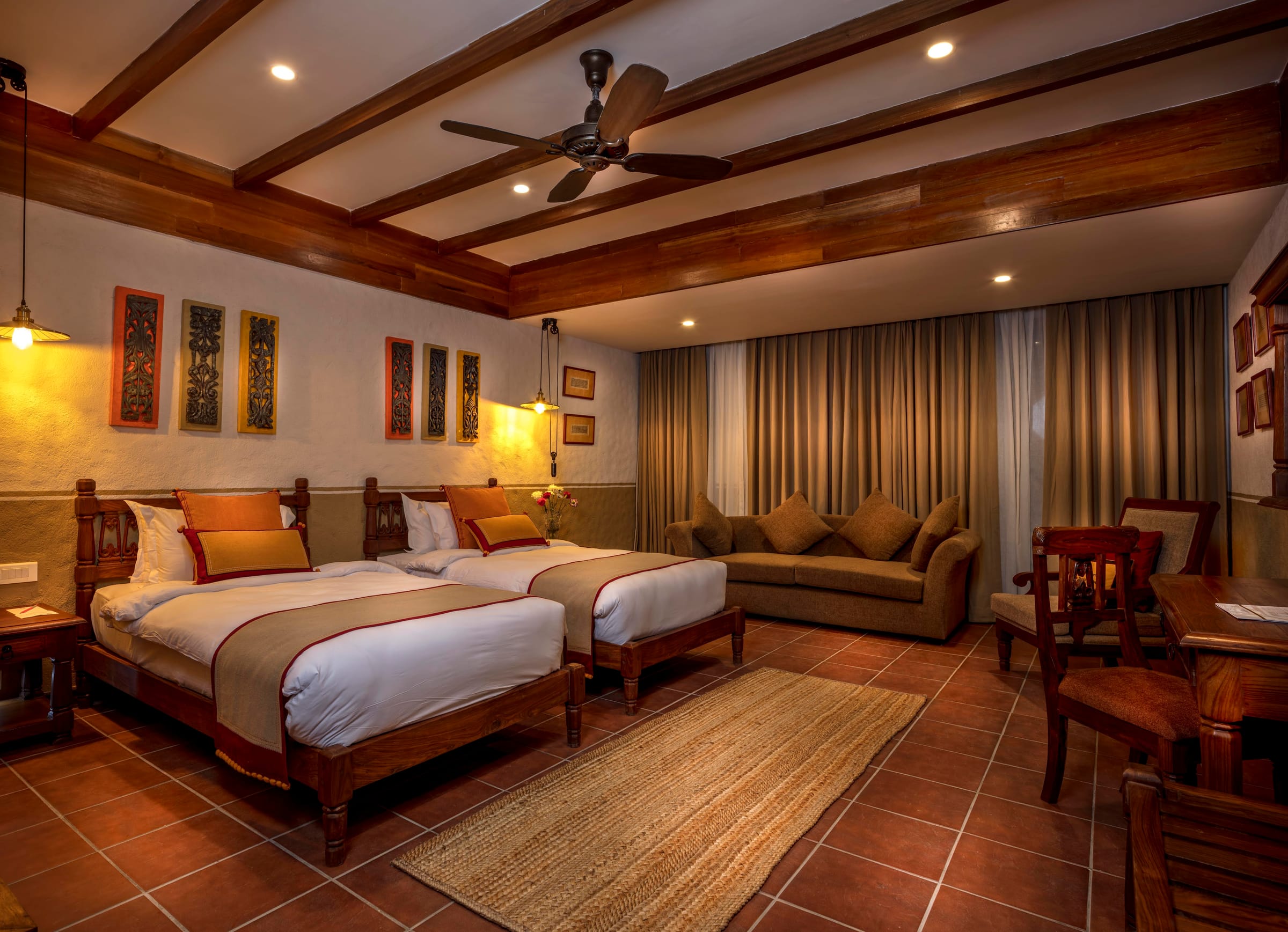 Heritage Deluxe Room in twin configuration with hand-carved twin beds