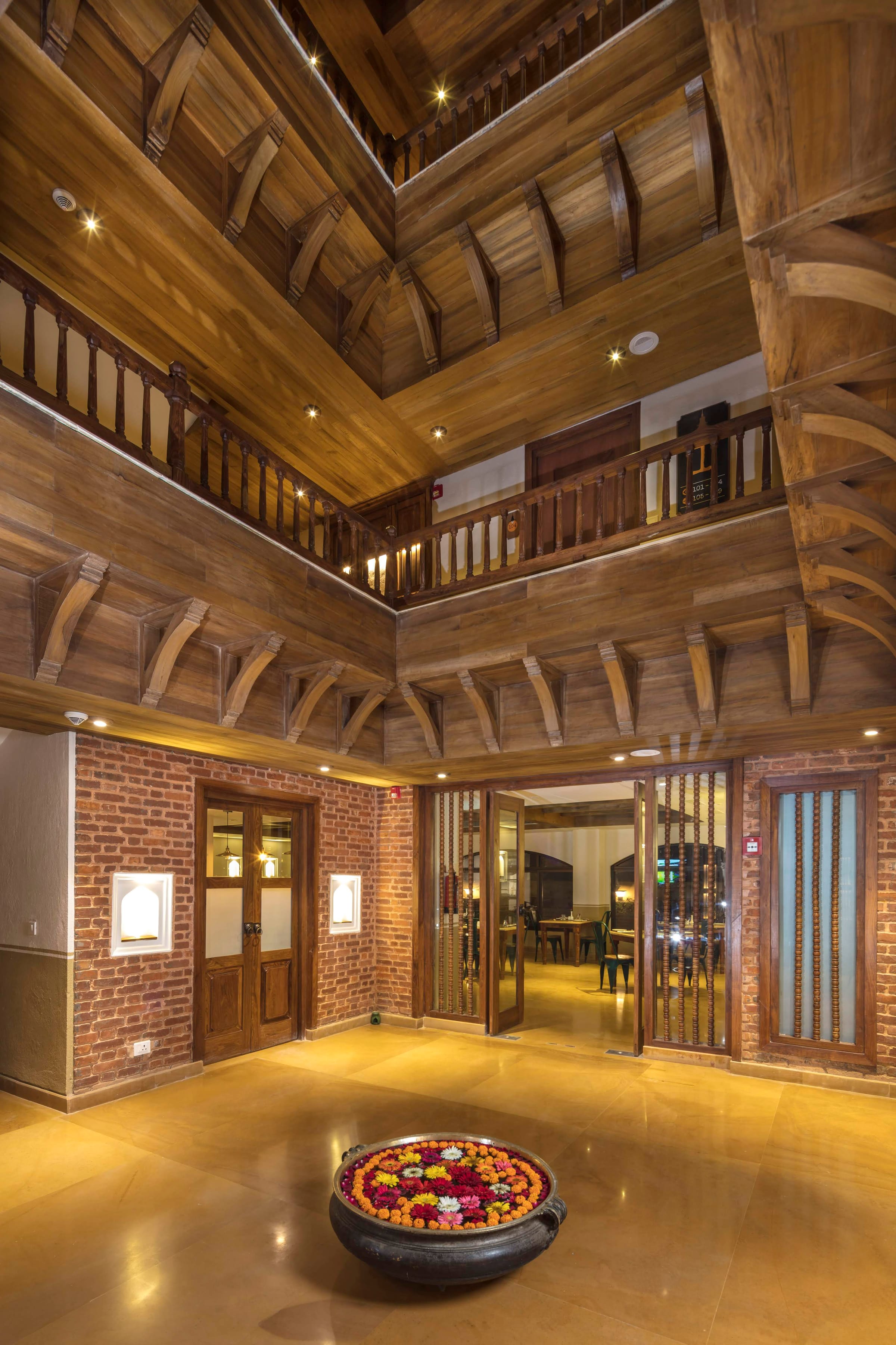 The warm hand-carved timber lobby of Nepali Ghar Hotel
