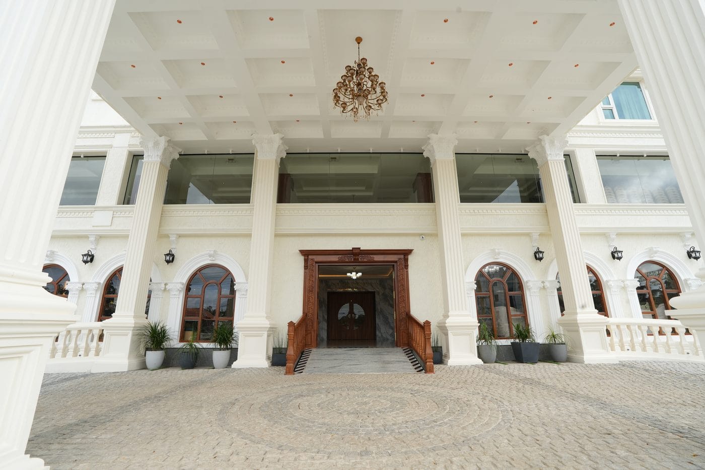 The carved timber main entrance of Captains Crown, framed by tall fluted columns