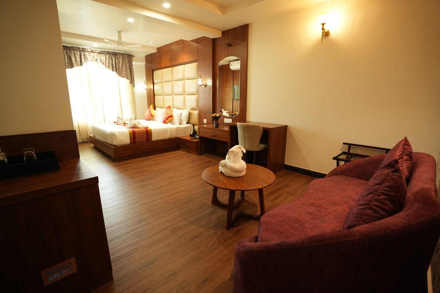 Presidential Suite sitting area, with a sofa, coffee table and work desk