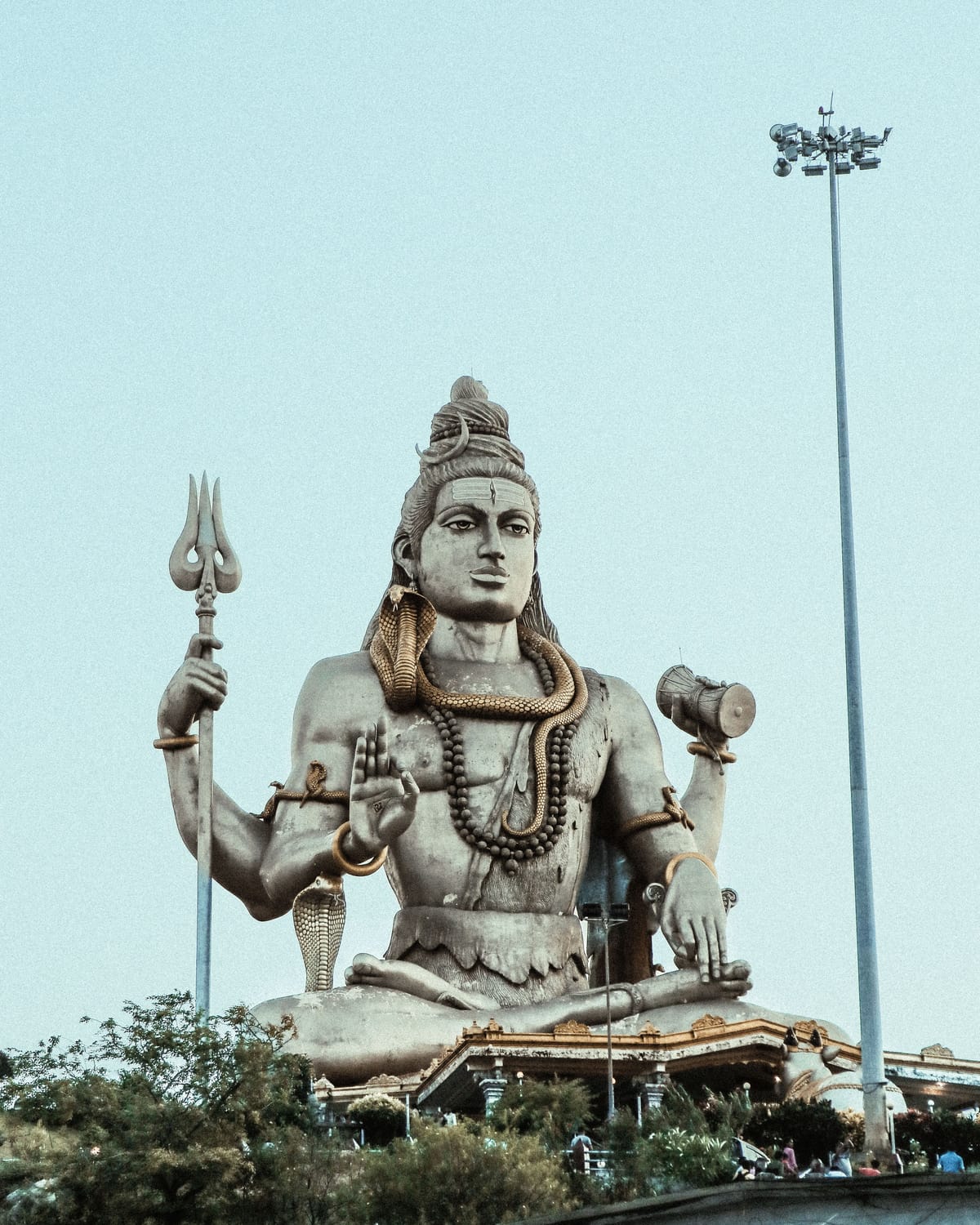 The towering Shiva statue at Nageshwar Mahadev near Dwarka, seated with a trident against the open sky