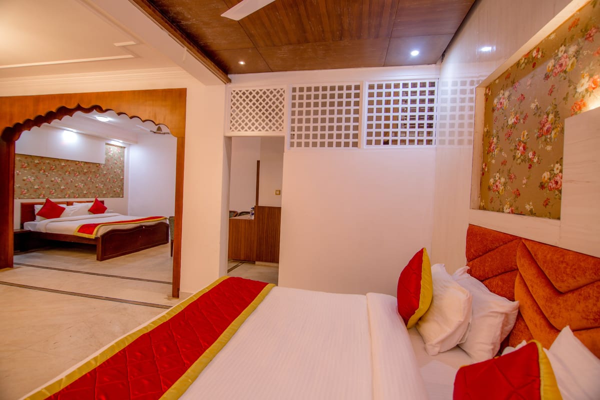The Maharani Suite at Hotel Karnika, with an arched opening through to the bedroom