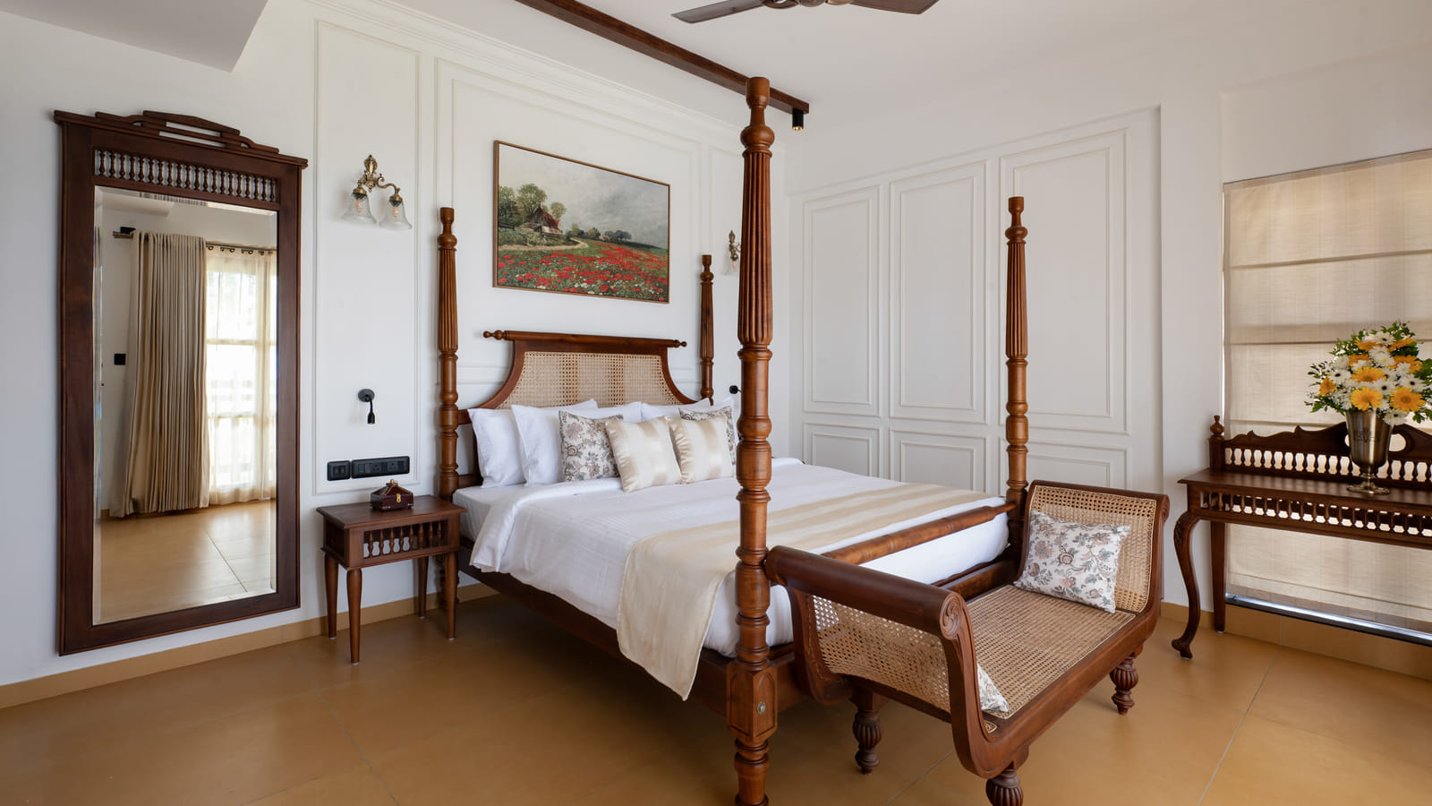 Heritage Suite four-poster bed with cane headboard, tall floor mirror and a large poppy-field painting on the wall, Sanskreti, Kumbalanghi
