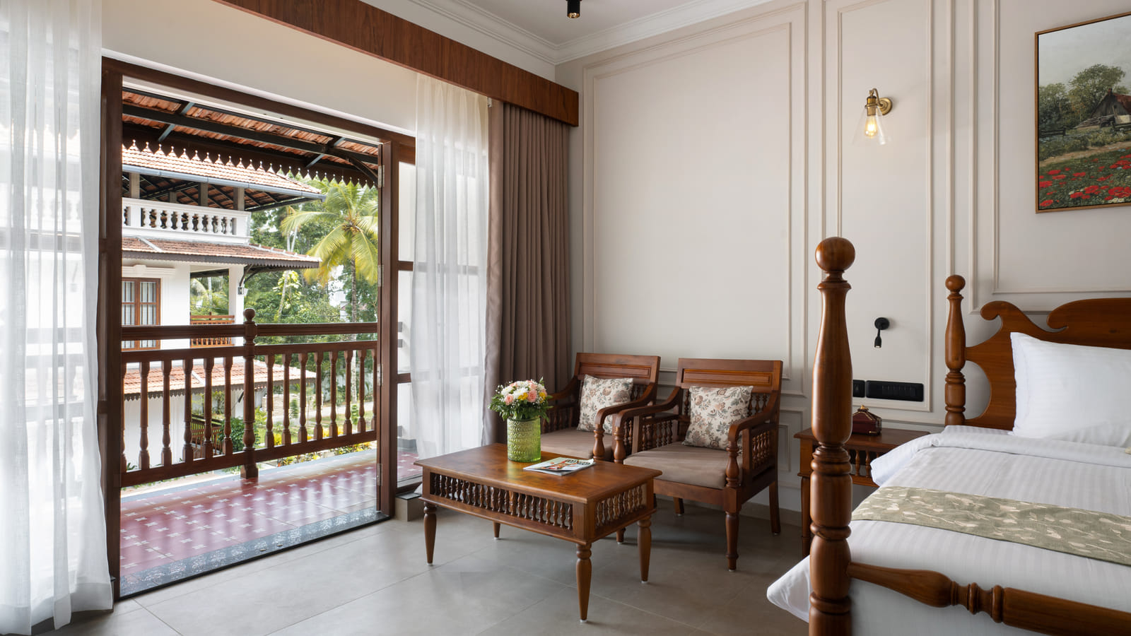 Pool View Room balcony looking over the infinity pool and coconut palms toward the backwater, Sanskreti