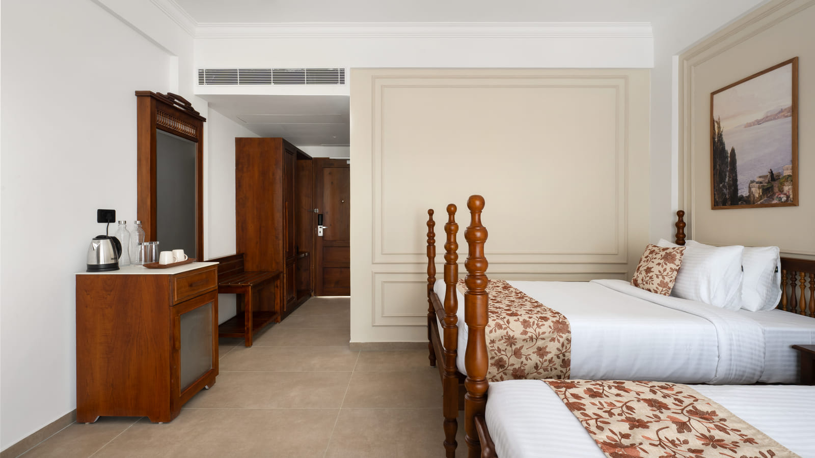 Pool View Twin Room with a tall wooden wardrobe, luggage bench and full-length mirror beside the twin beds, Sanskreti