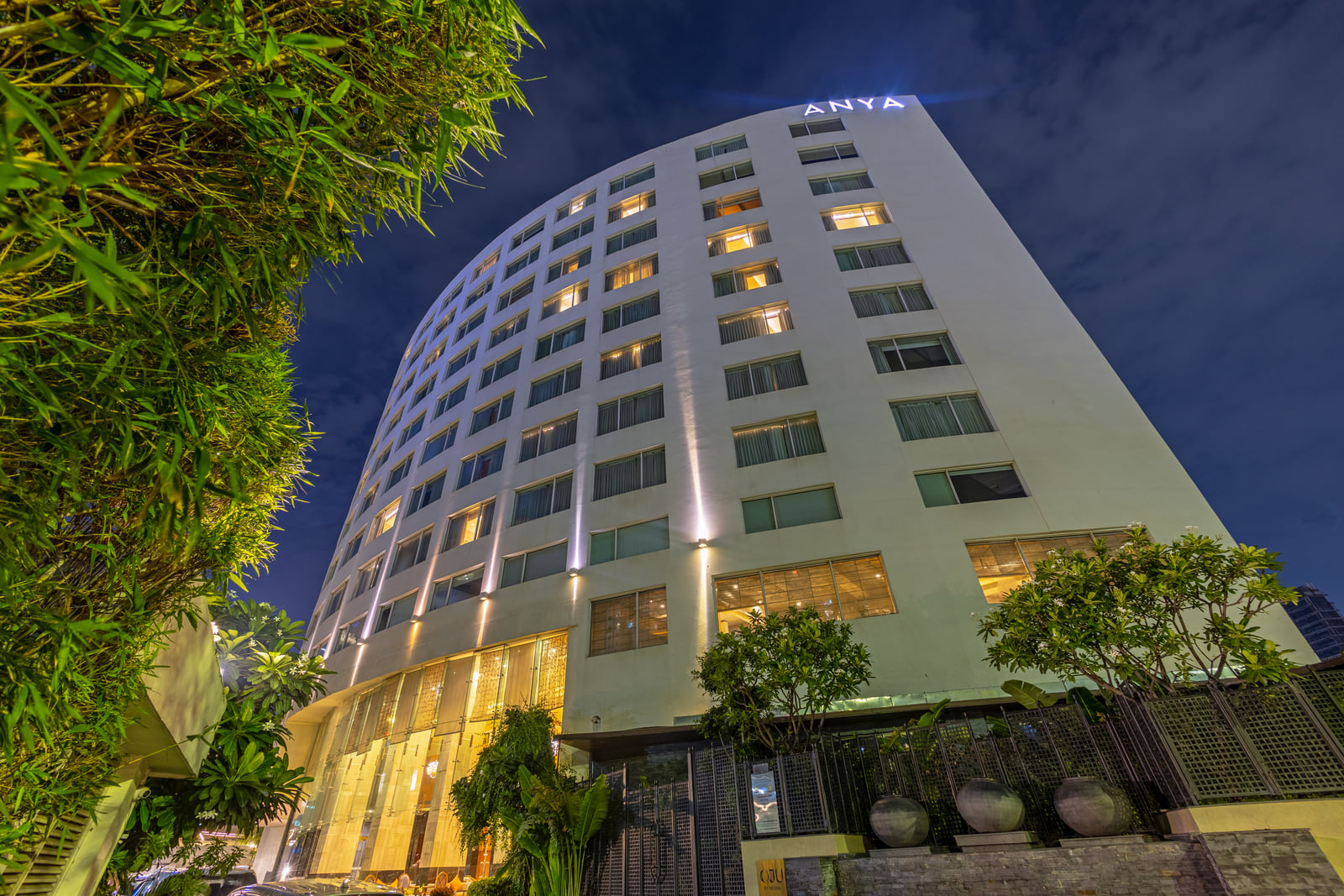 Exterior of The Anya Hotel, Gurugram at dusk