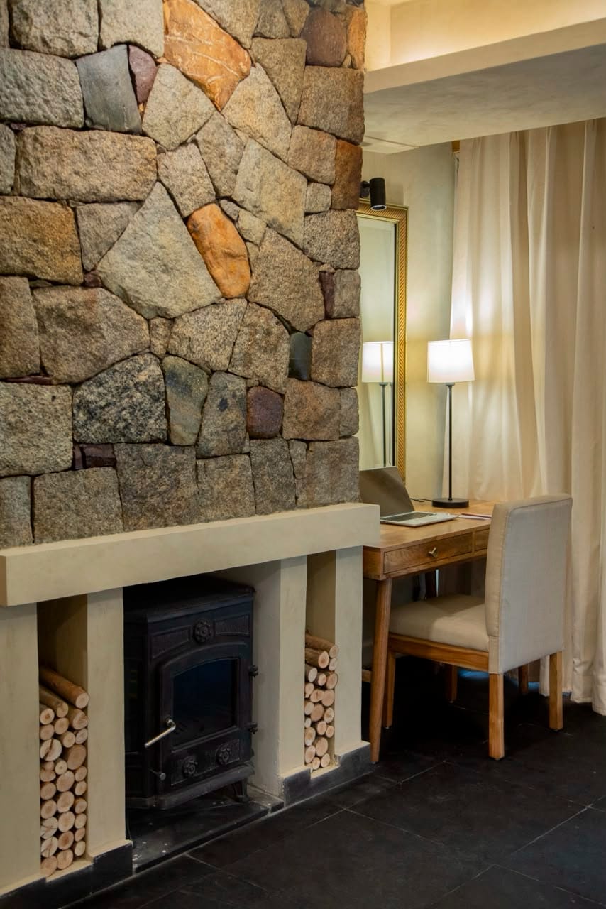 Stone fireplace and desk