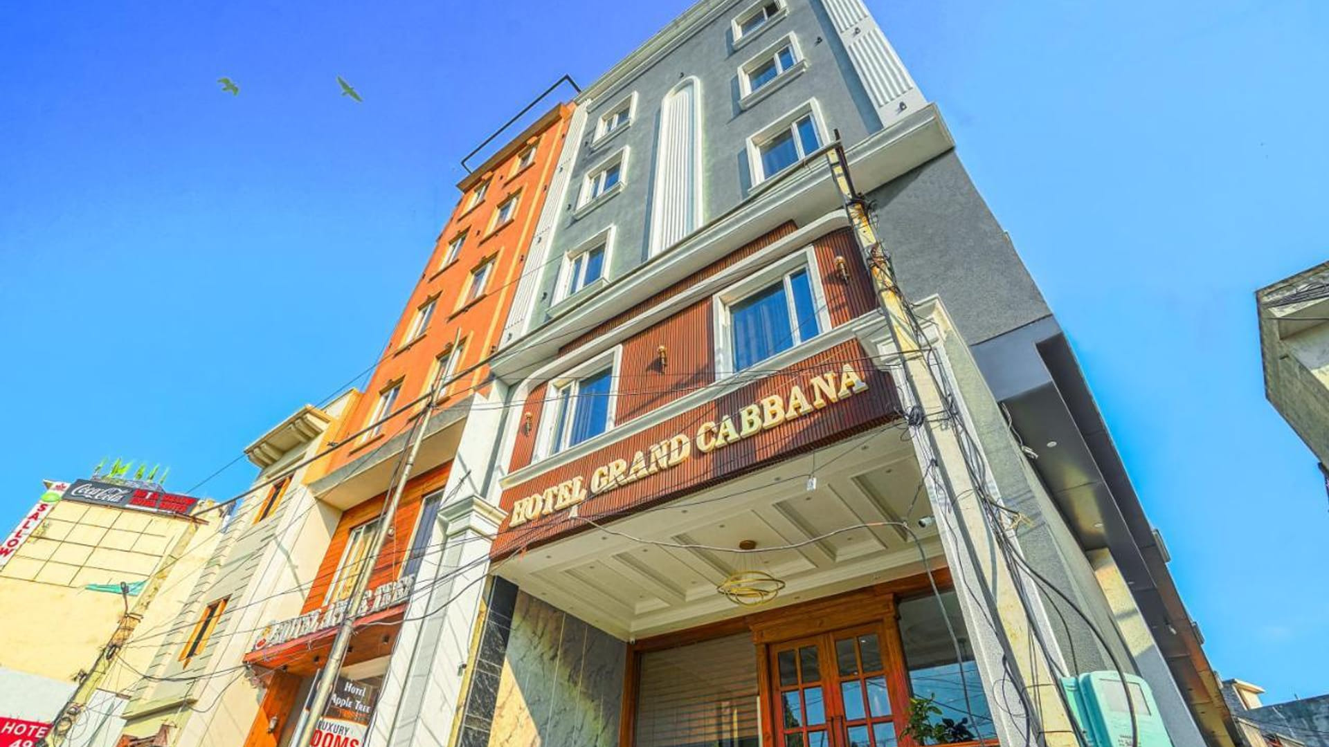The exterior of Grand Cabbana in Amritsar seen from the street below, the signage