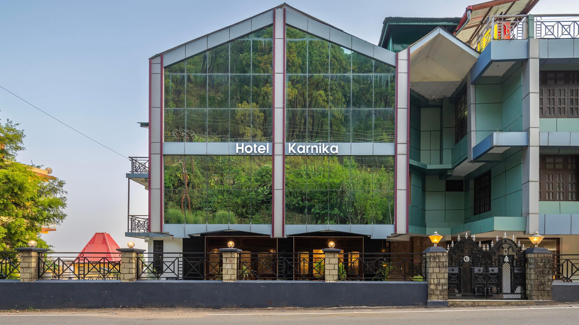 The frontage of Hotel Karnika in Darnu by day, its tall glazed gable