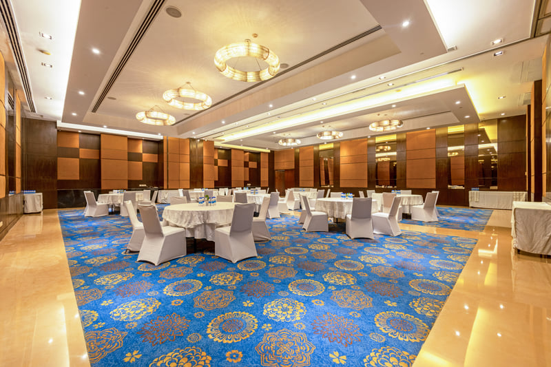 The banquet hall set for a conference at The Anya Hotel, Gurugram