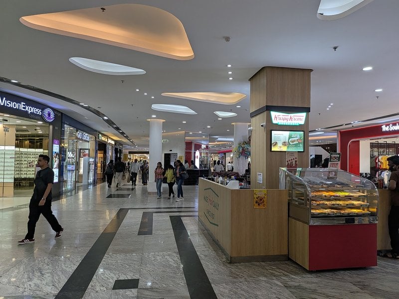 Shoppers in a shopping mall concourse