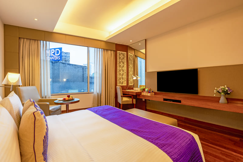 Deluxe Room king bed with city view at The Anya Hotel, Gurugram