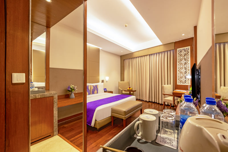 Deluxe Room entrance and minibar at The Anya Hotel, Gurugram