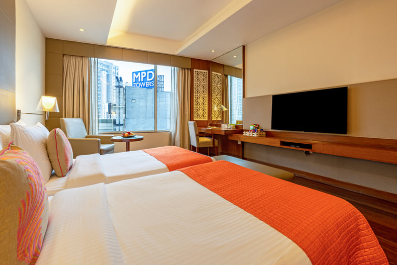 Deluxe Room twin beds with city view at The Anya Hotel, Gurugram