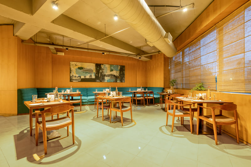Naya restaurant comfortable seating at The Anya Hotel, Gurugram