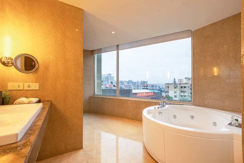 In-room jacuzzi in the Studio Suite at The Anya Hotel, Gurugram