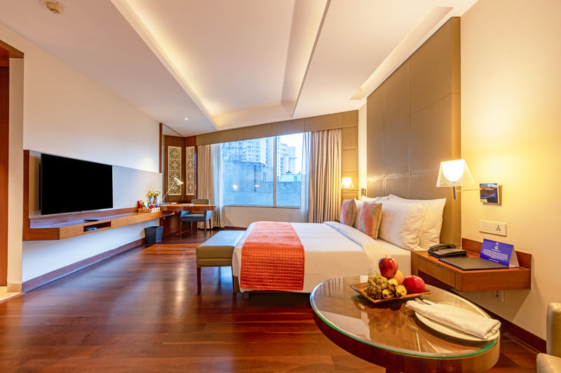Studio Suite bedroom and lounge at The Anya Hotel, Gurugram