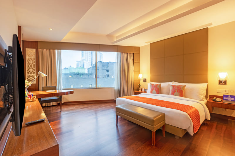 Studio Suite bedroom with city view at The Anya Hotel, Gurugram