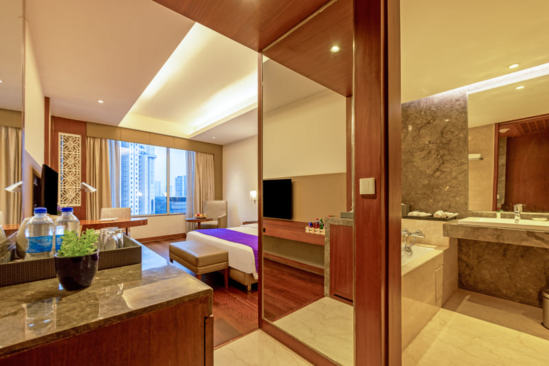 Superior Room entrance with the bathroom beyond at The Anya Hotel, Gurugram