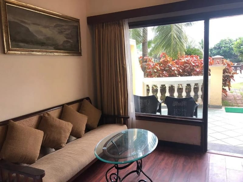 Deluxe room with garden and pool view at The Hans Coco Palms, Puri