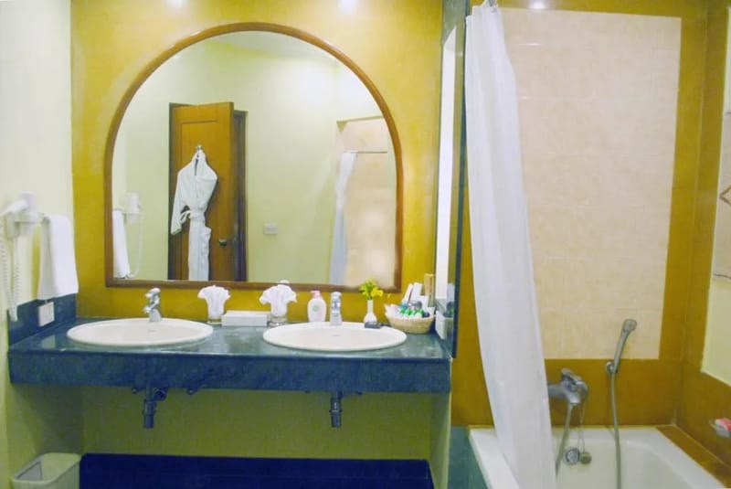 Deluxe Suite bathroom at The Hans Coco Palms, Puri