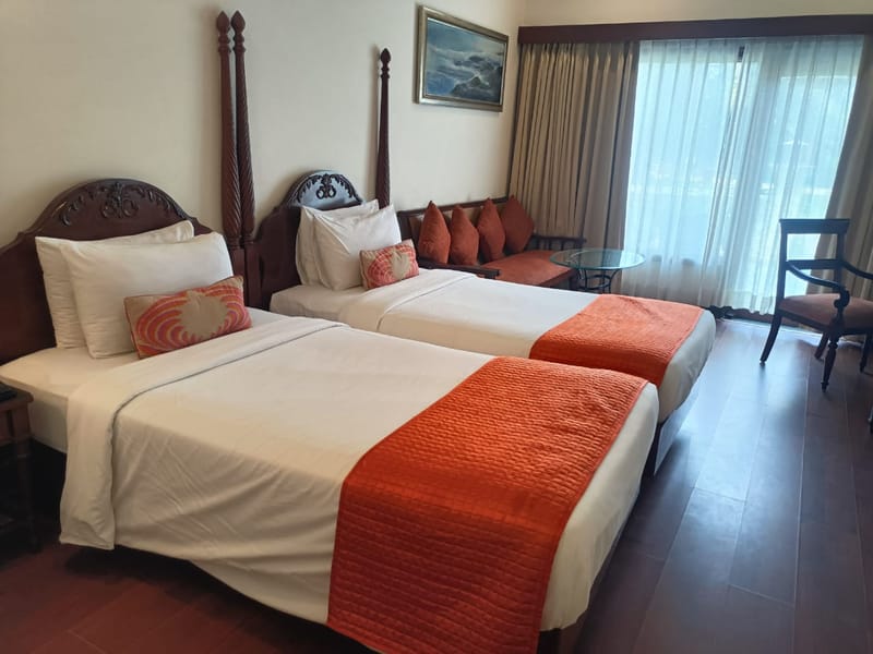 Deluxe twin room with pool and garden view at The Hans Coco Palms, Puri