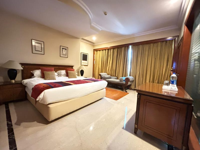 Deluxe Suite bedroom at The Hans, New Delhi