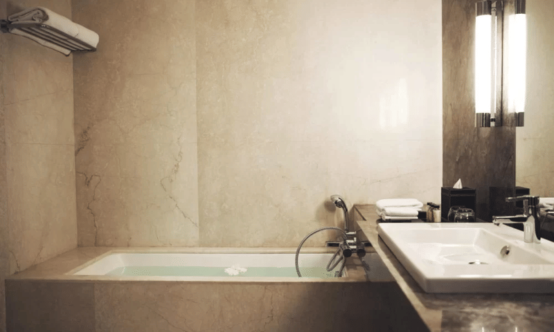 Luxury Suite bathroom with bathtub at The Anya Hotel, Gurugram