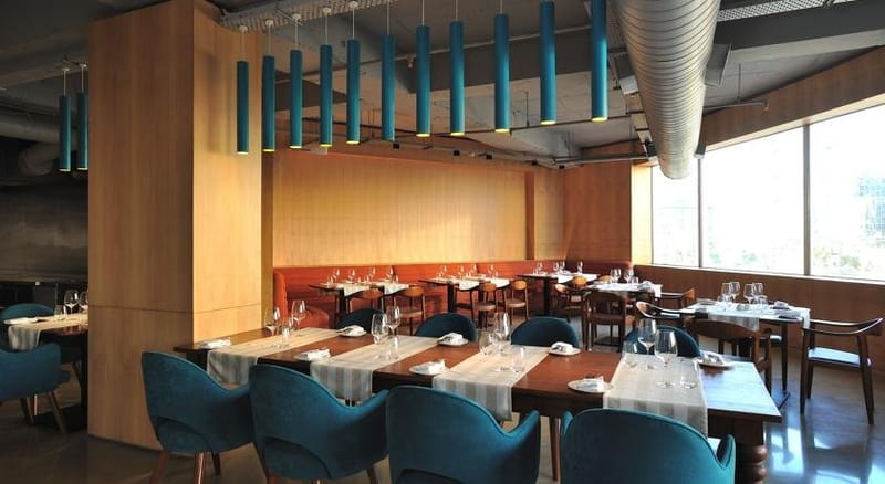 Naya restaurant comfortable seating at The Anya Hotel, Gurugram