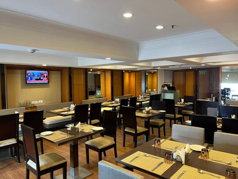 Restaurant seating at Kaffa, The Hans, New Delhi