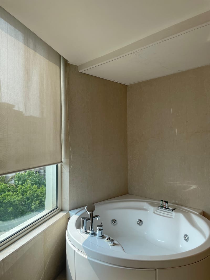 In-room jacuzzi in the Studio Suite at The Anya Hotel, Gurugram