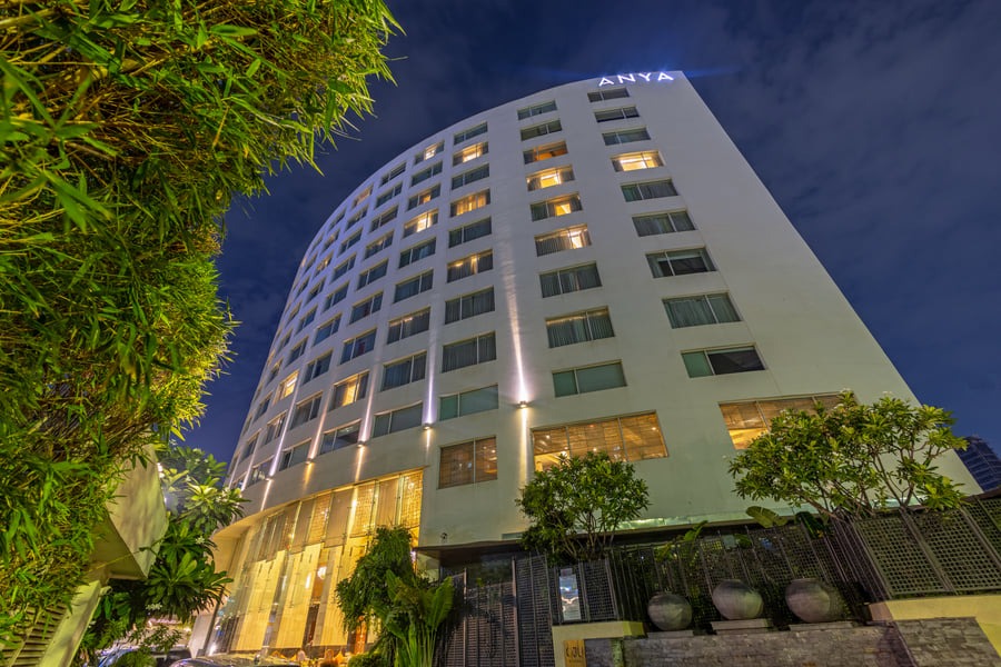 Exterior of The Anya Hotel, Gurugram at dusk
