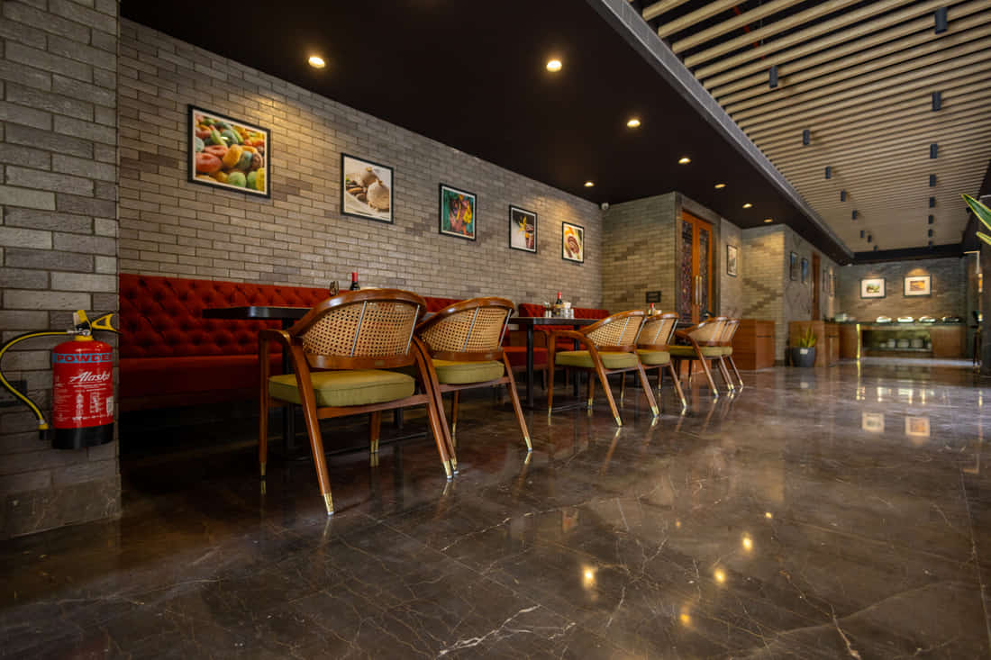 The warm, contemporary dining interior of Kaleidoscope at KSN Signature, Jaipur