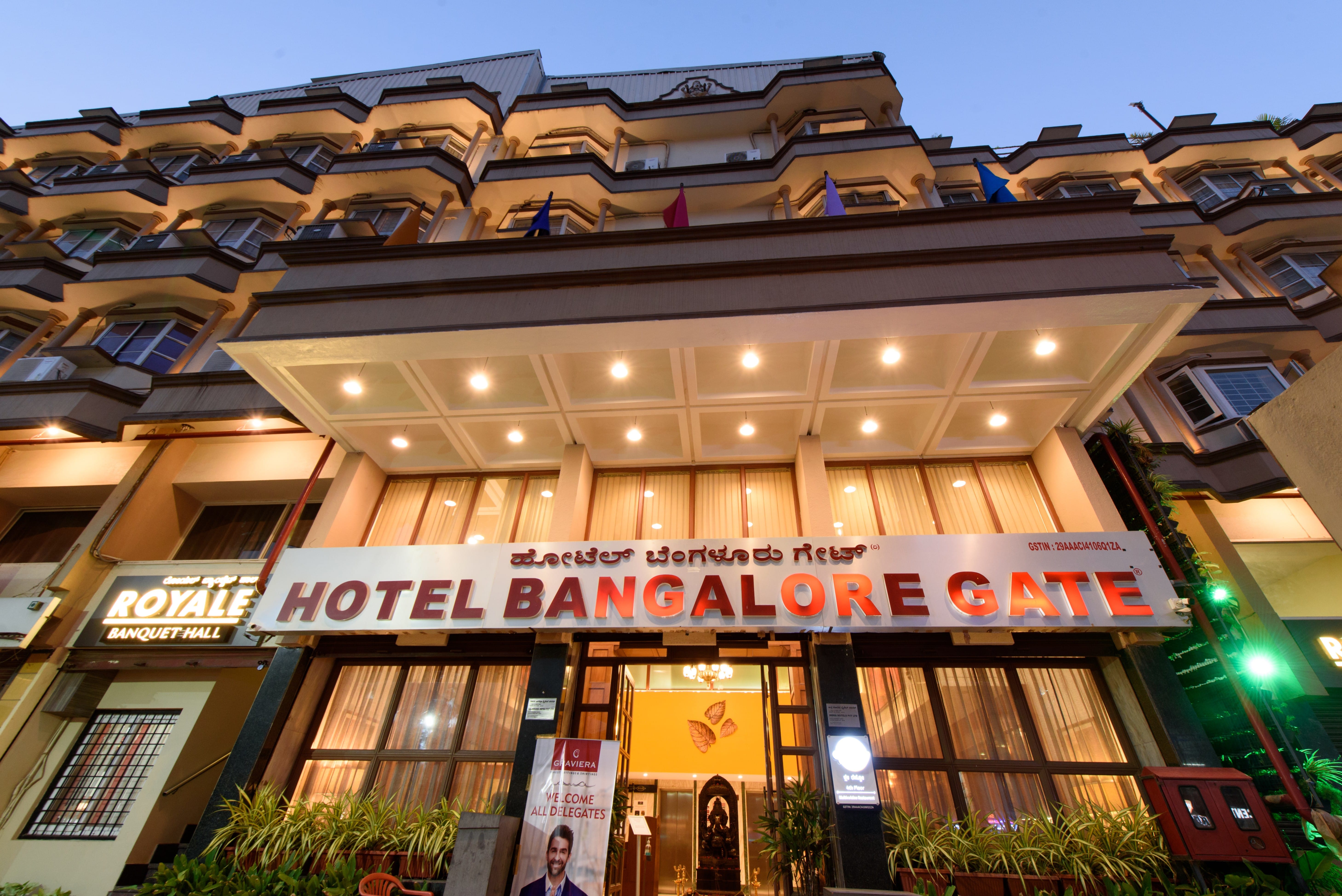 Bangalore Gate Hotel illuminated at night on Kempegowda Road, Bengaluru