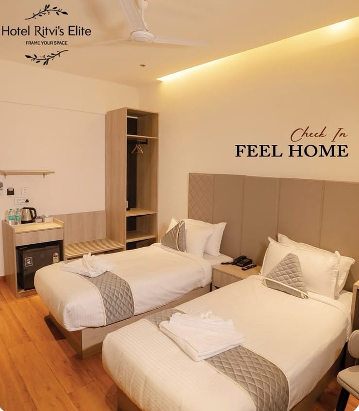 Executive Twin Room with two beds and an open wardrobe