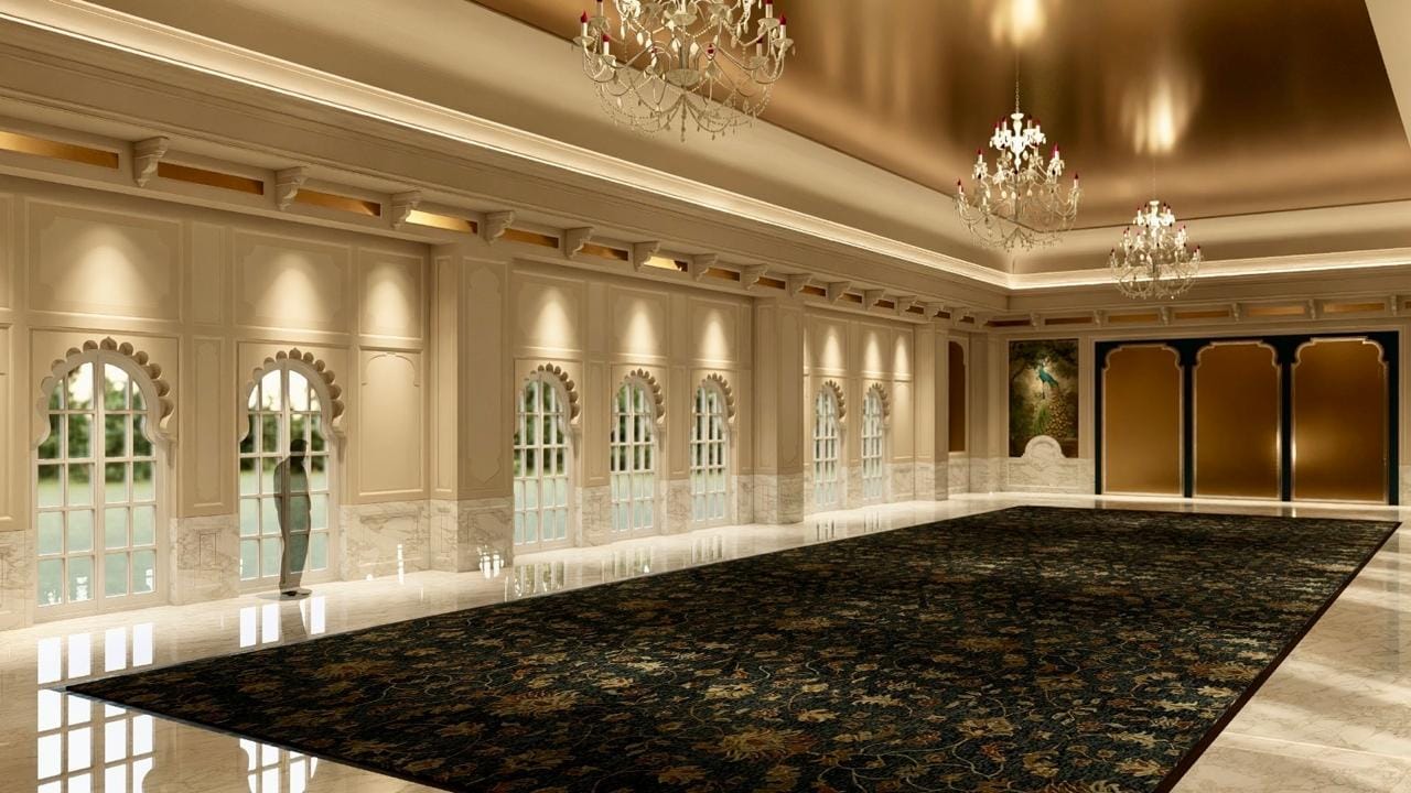 Kingsbury indoor banquet hall with arched windows, crystal chandeliers and a dark patterned carpet