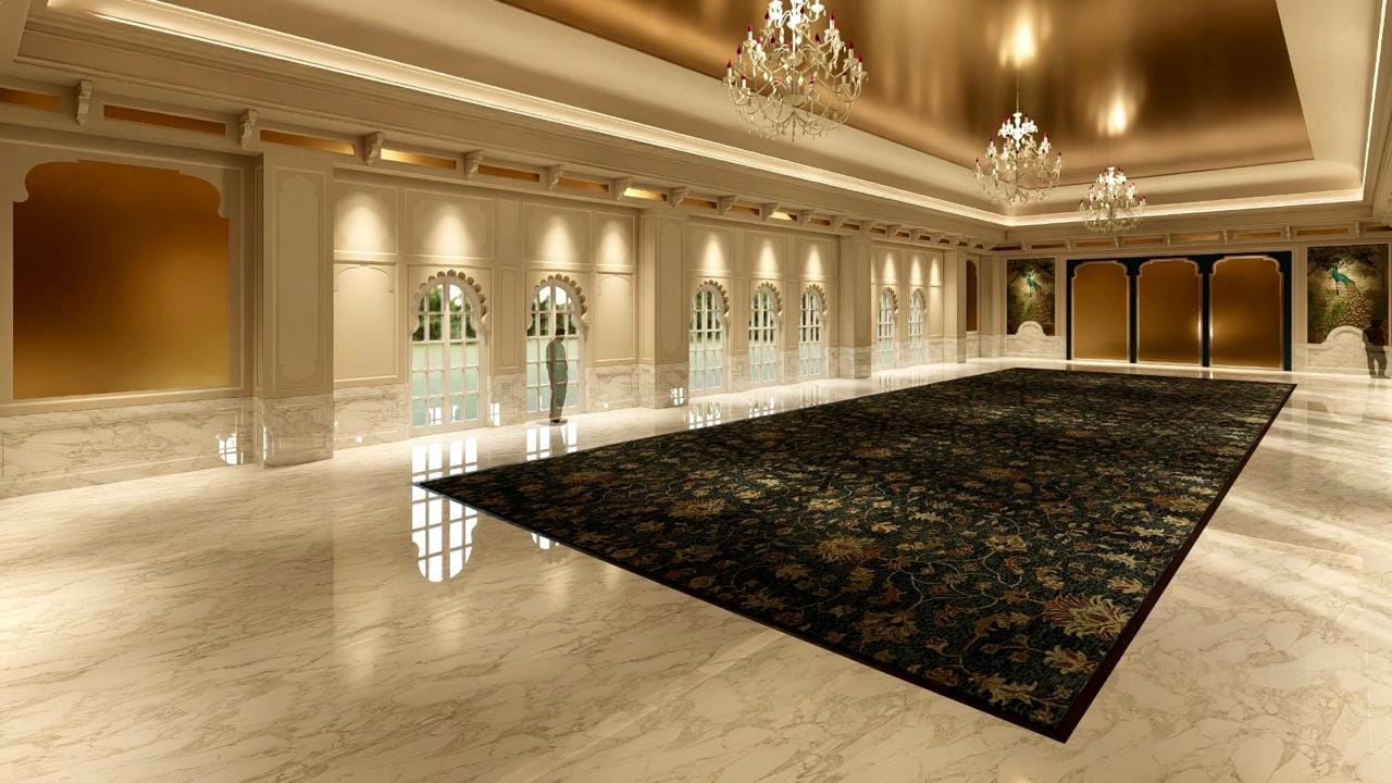 Wide pillarless Kingsbury banquet hall with polished marble floor and a dark patterned carpet runner
