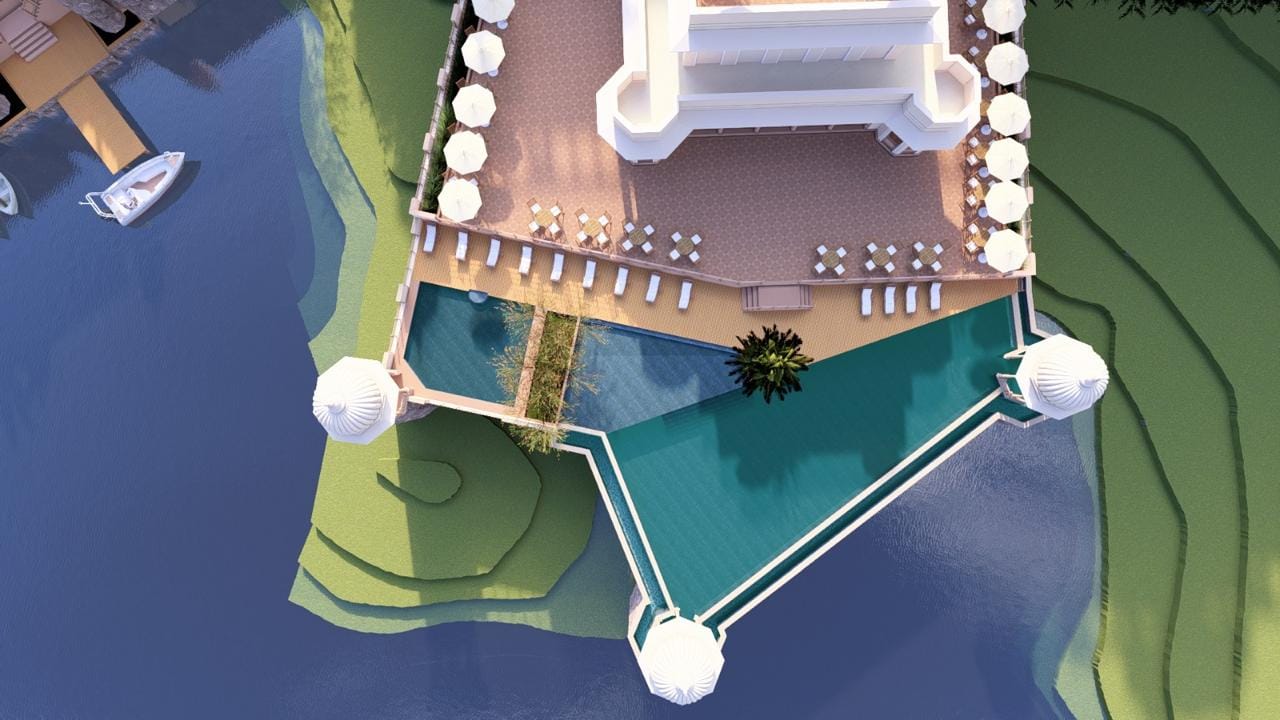 Aerial view of the triangular infinity pool ringed by domed cabanas